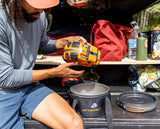 The award-winning Genesis Basecamp System is the ultimate all-in-one backcountry cooking system, stowing neatly into itself and fitting snugly among your gear.